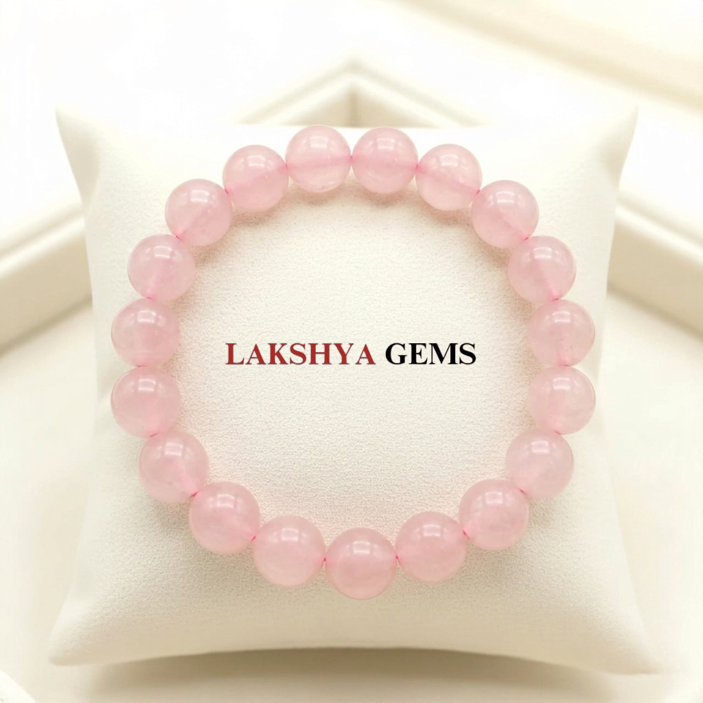 Natural Rose Quartz crystal bracelet featuring polished, translucent soft pink beads on a clear stretch cord from lakshya gems