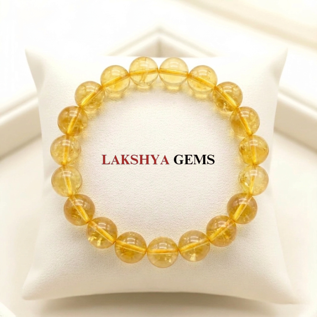 Natural Citrine crystal bracelet featuring polished, transparent golden-yellow beads on a clear stretch cord from lakshya gems