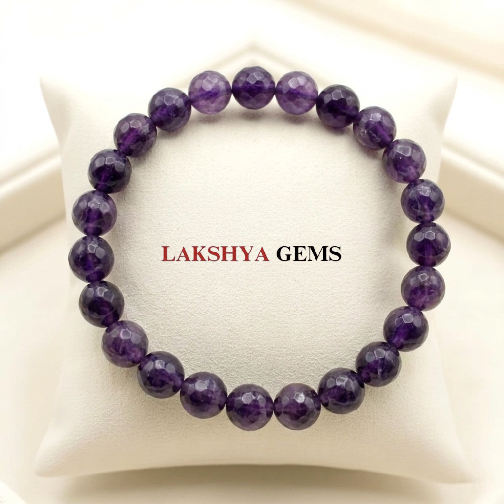 Natural Amethyst crystal bracelet featuring polished, deep purple translucent beads on a stretch cord.