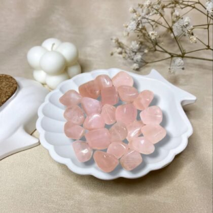 Group of polished Rose Quartz tumble stones in a soft translucent pink for love and healing from lakshya gems mumbai