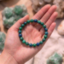 A premium Azurite crystal bead bracelet featuring deep, midnight-blue natural stones with a smooth polished finish.