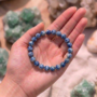 Natural Sodalite crystal bracelet featuring polished indigo-blue beads with white calcite veining.