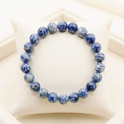 Natural Sodalite crystal bracelet featuring polished indigo-blue beads with white calcite veining from lakshya gems