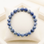 Natural Sodalite crystal bracelet featuring polished indigo-blue beads with white calcite veining from lakshya gems
