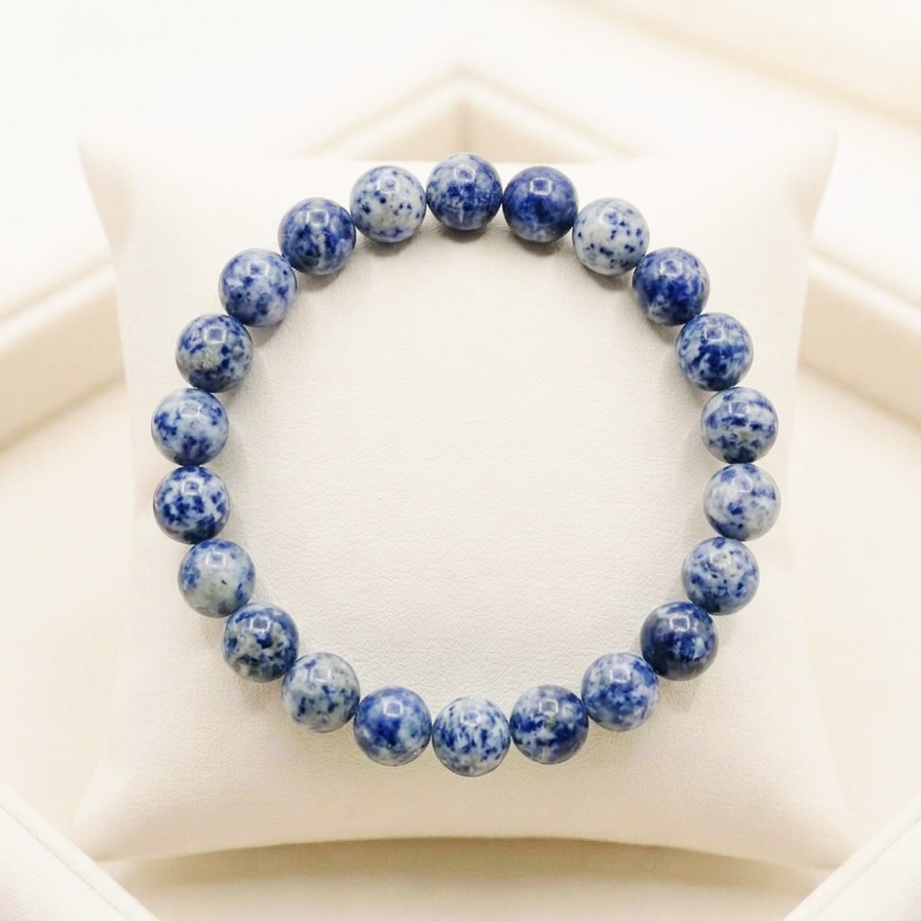 Natural Sodalite crystal bracelet featuring polished indigo-blue beads with white calcite veining from lakshya gems