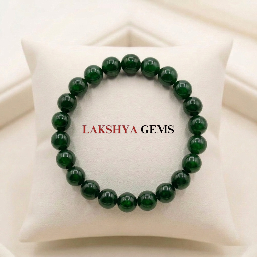 A premium Green Jade crystal bead bracelet showing various shades of natural forest green with a polished, waxy luster