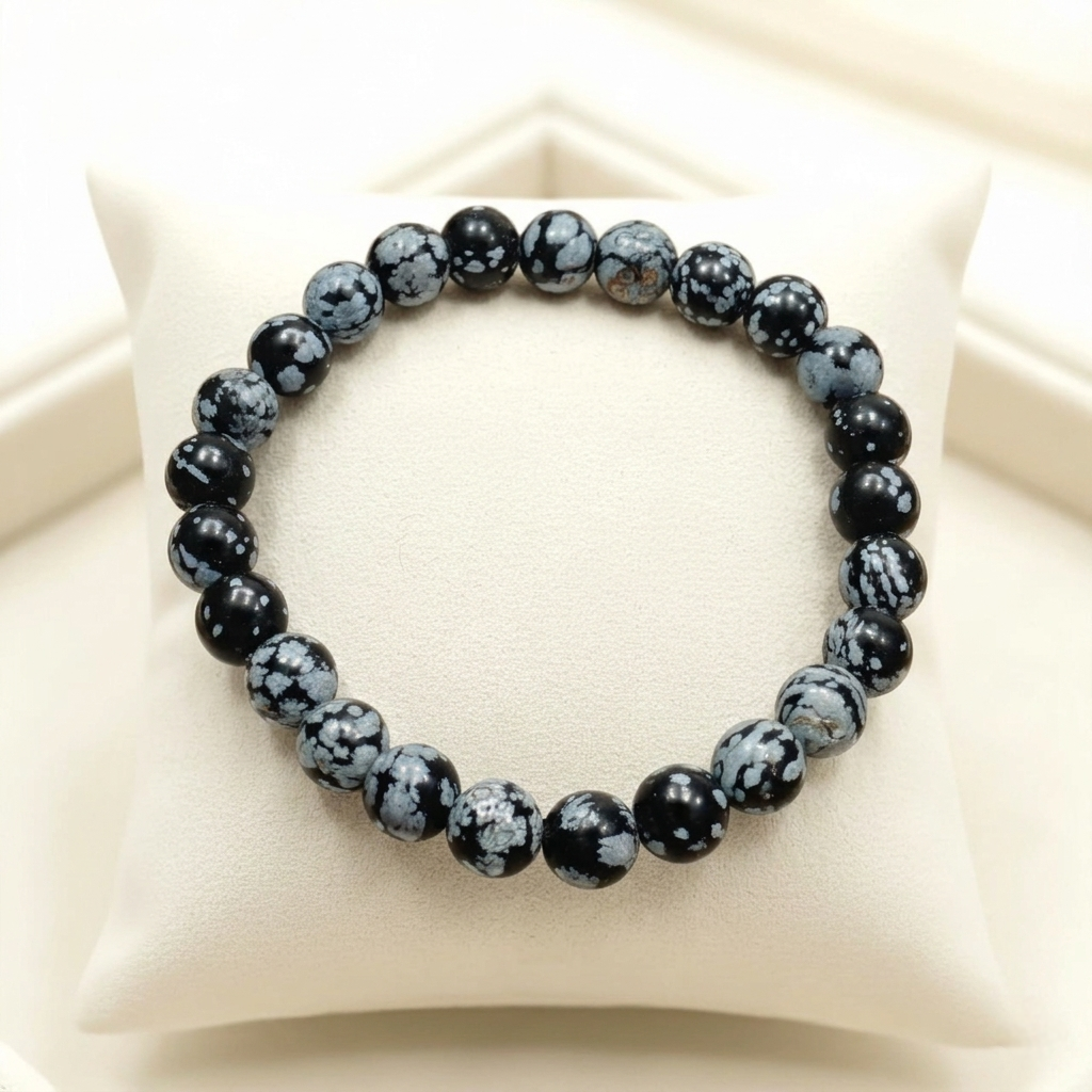 Authentic Snowflake obsidian bracelet with natural black and white cristobalite obsidian beads for root chakra grounding and emotional balance from Lakshya Gems