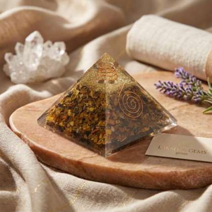 Natural Tiger Eye crystal pyramid showing shimmering golden and brown chatoyant bands with a polished finish lakshya gems mumbai