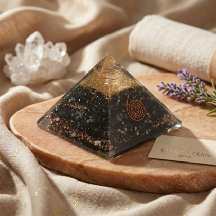 Natural Black Tourmaline pyramid showing a polished, solid black surface with a precise four-sided shape from lakshya gems