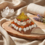 Dhan Lakshmi Pyramid with a clear resin finish showing Shree Yantra, Gomti Chakra, and Rudraksha beads inside from Lakshya Gems mumbai