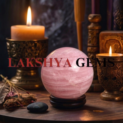 A polished natural Rose Quartz sphere featuring a soft milky-pink color and natural internal crystal veils.