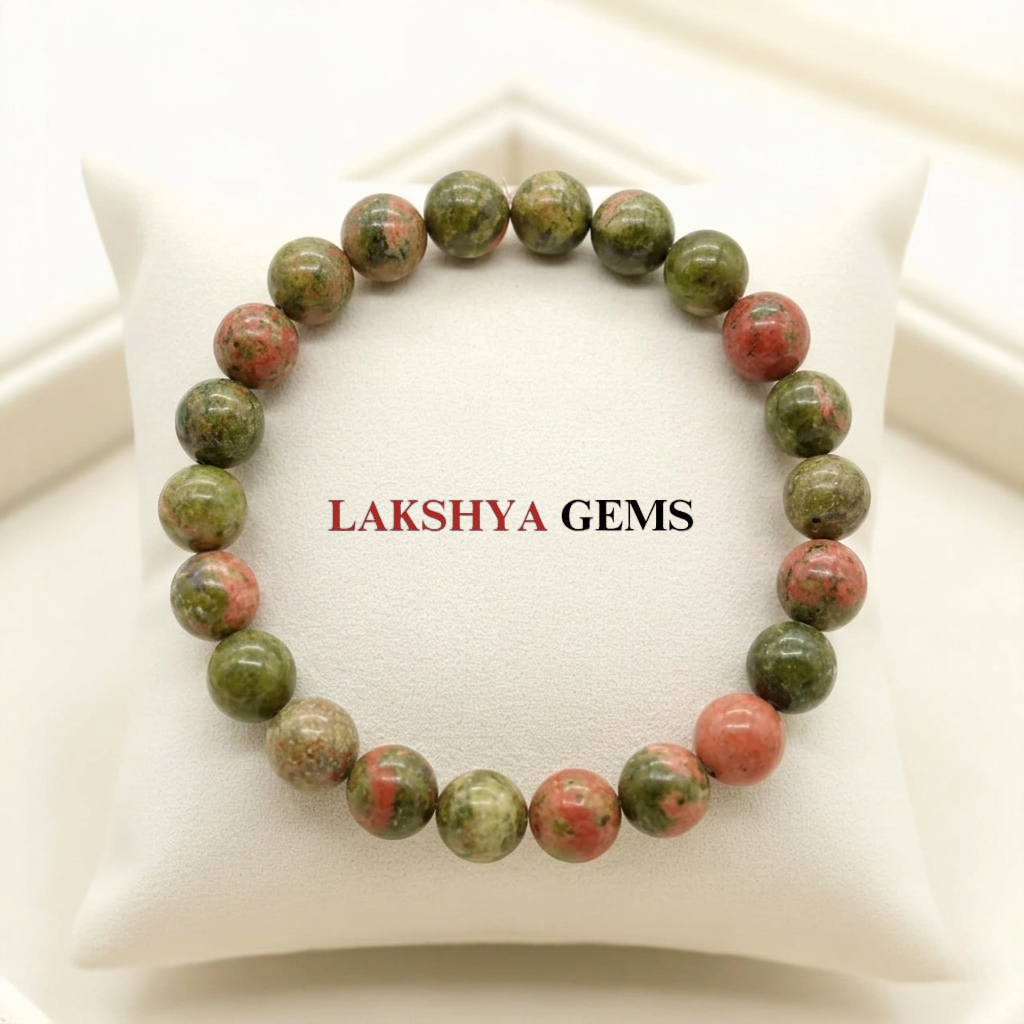 A high-quality Unakite crystal bead bracelet featuring a natural mottled pattern of olive green and peachy-pink colors.