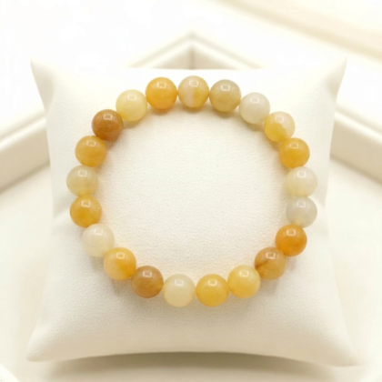 A high-quality Yellow Aventurine crystal bead bracelet showing a warm golden-yellow color and smooth polished finish.