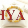 A high-quality Yellow Aventurine crystal bead bracelet showing a warm golden-yellow color and smooth polished finish.