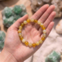A high-quality Yellow Aventurine crystal bead bracelet showing a warm golden-yellow color and smooth polished finish.