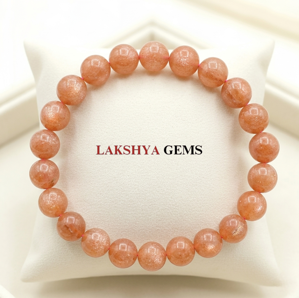 A premium Sunstone crystal bead bracelet showing warm peachy-orange colors with natural internal metallic sparkles.
