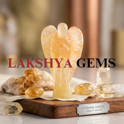 A hand-carved natural Citrine crystal angel showing transparent golden-yellow hues and polished finish.