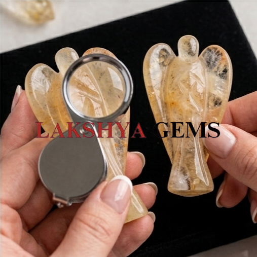 citrine crystal angel from lakshya gems mumbai A hand-carved natural Citrine crystal angel showing transparent golden-yellow hues and polished finish.