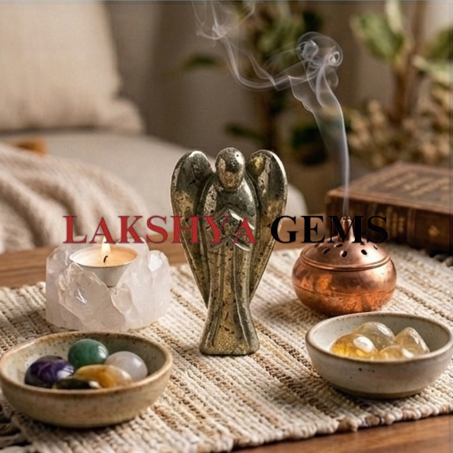 Pyrite crystal Angel from lakshya gems mumbai A hand-carved natural Pyrite crystal angel featuring a brilliant metallic gold luster and polished finish.