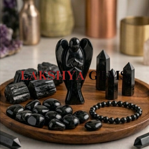 A hand-carved natural Black Tourmaline crystal angel with a deep jet-black color and smooth polished finish.