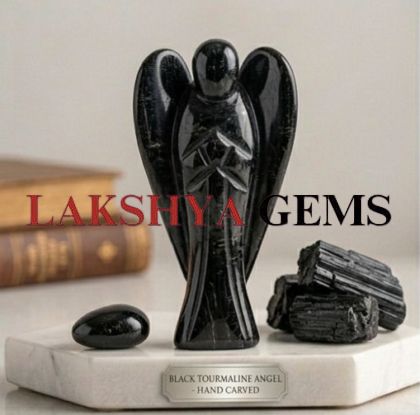 A hand-carved natural Black Tourmaline crystal angel with a deep jet-black color and smooth polished finish.