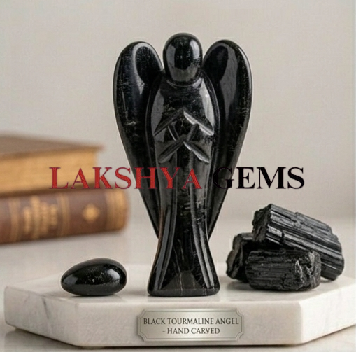 A hand-carved natural Black Tourmaline crystal angel with a deep jet-black color and smooth polished finish.