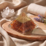 A polished natural Carnelian Crystal pyramid showing vibrant orange-red hues from the Lakshya Gems collection.