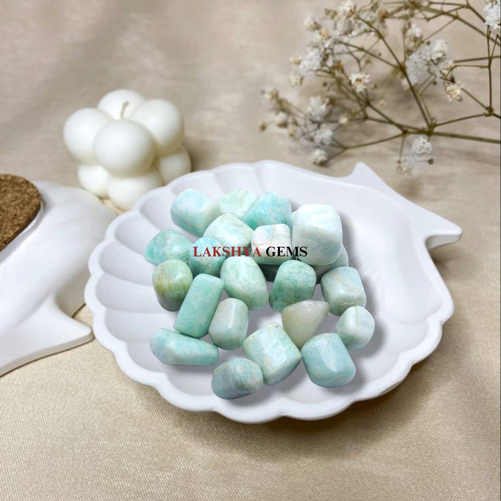 Polished Amazonite tumble stones in various shades of turquoise green for truth and calm.