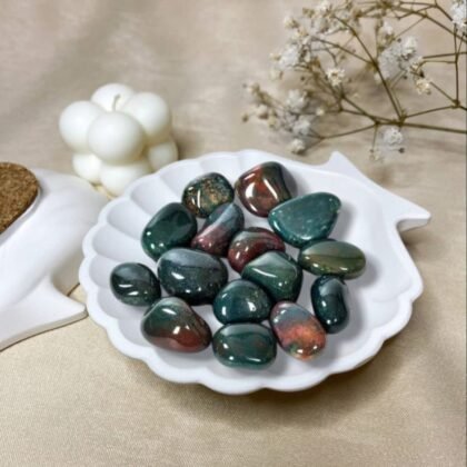 Polished Bloodstone crystal tumble stones featuring deep green colors with natural red jasper flecks.