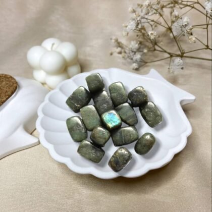 Labradorite tumble stones placed on a meditation altar to enhance spiritual connection.