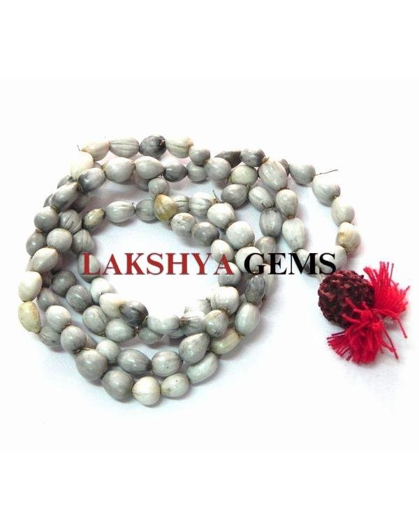 Authentic off-white Vaijanti Japa Mala with 108 natural seeds and a yellow tassel.