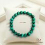 Natural Malachite beaded bracelet with vibrant green swirling patterns and high-gloss finish.