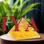 Polished natural Citrine pyramid with a transparent golden yellow hue for wealth manifestation.