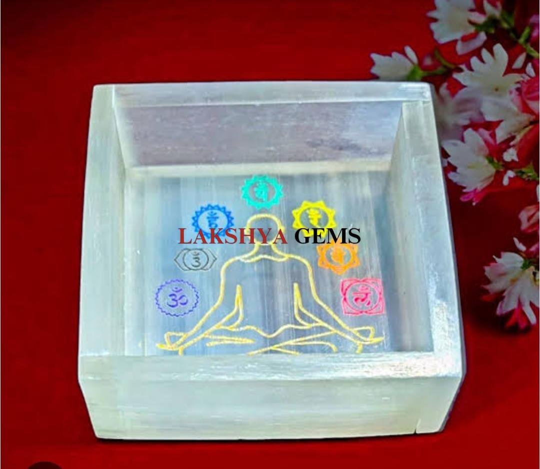 Hand-carved Selenite box with seven chakra symbols engraved on the lid for crystal charging.