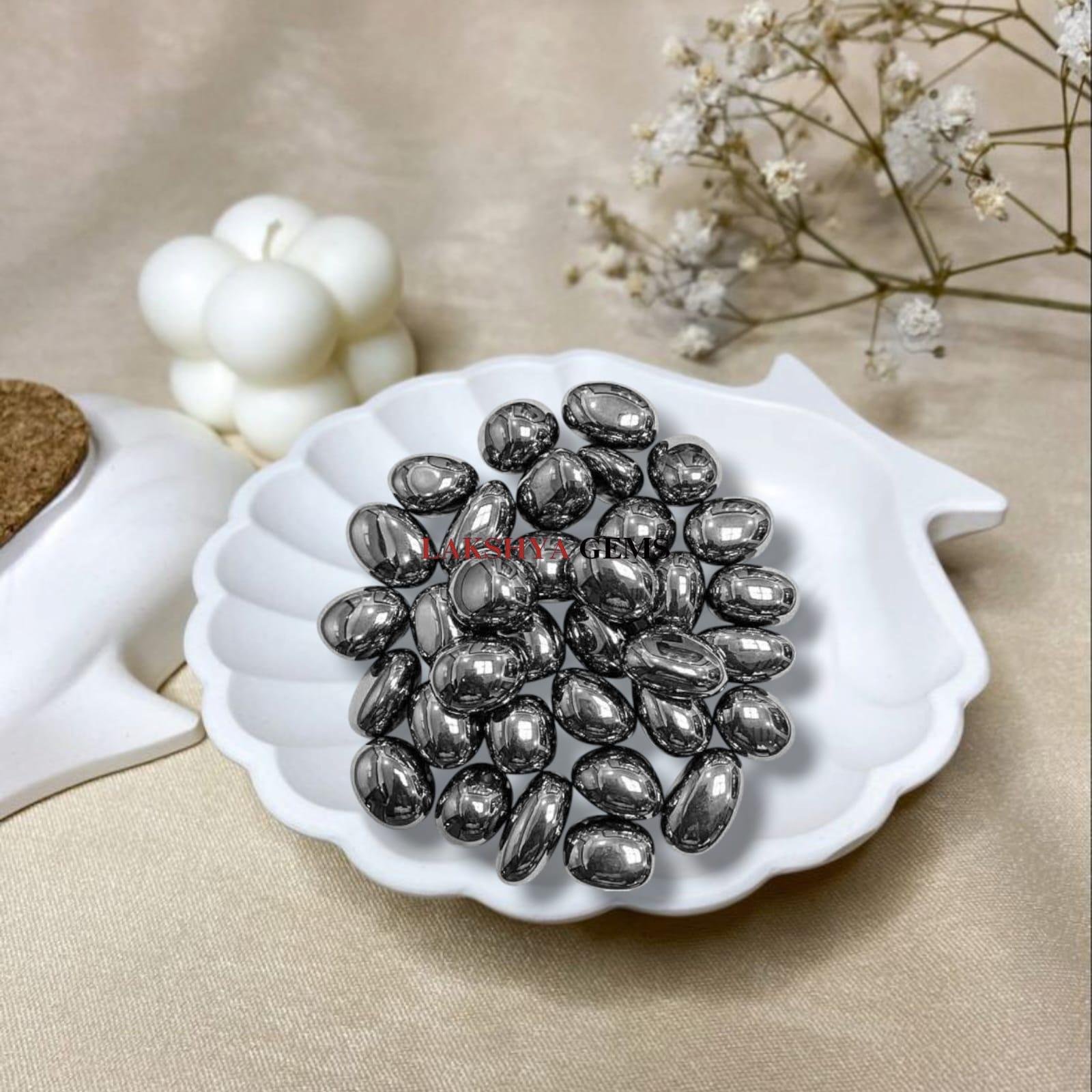 Authentic Elite Shungite tumble stone with a bright silver metallic luster for EMF protection.