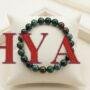 Natural Bloodstone crystal bracelet featuring polished forest-green beads with red jasper inclusions.