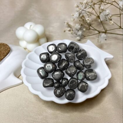 High-luster metallic Hematite tumble stones with a reflective silver-grey finish for grounding.