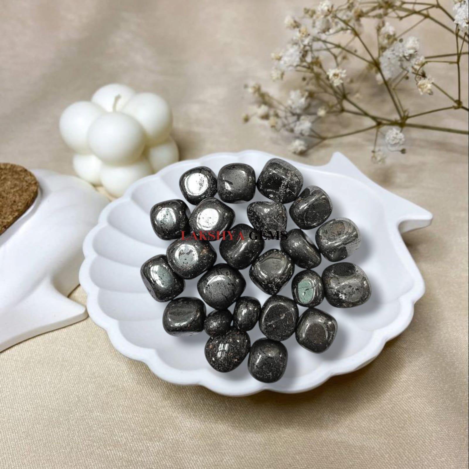 High-luster metallic Hematite tumble stones with a reflective silver-grey finish for grounding.