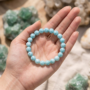 Rare natural Larimar beaded bracelet featuring soft sky-blue colors and white volcanic marbling lakshya gems