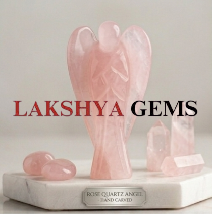 A hand-carved natural Rose Quartz crystal angel featuring soft pink hues and a smooth polished finish.