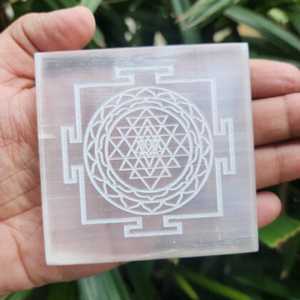 4-inch square round Selenite charging plate engraved with Shree Yantra for cleansing crystal jewelry.
