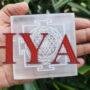 4-inch square round Selenite charging plate engraved with Shree Yantra for cleansing crystal jewelry.
