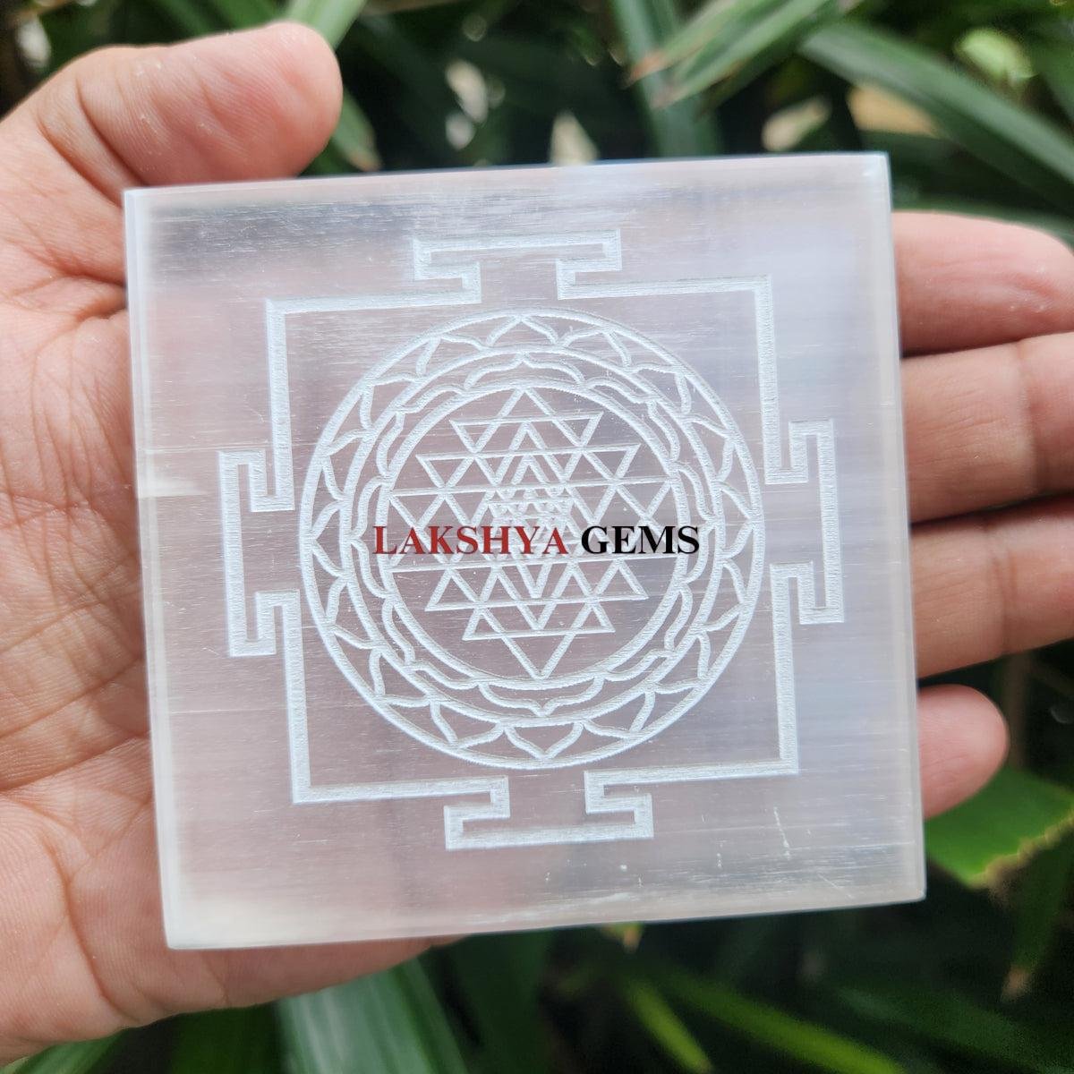 4-inch square round Selenite charging plate engraved with Shree Yantra for cleansing crystal jewelry.