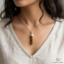 Natural Tiger’s Eye pencil pendant with golden chatoyant bands and silver-etched bail.