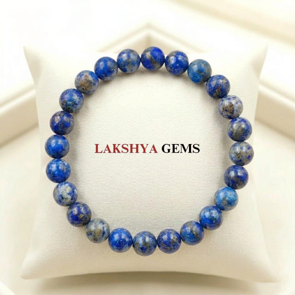 Natural Lapis Lazuli beaded bracelet featuring deep indigo blue stones with golden pyrite flecks.