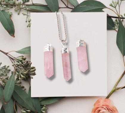 Natural Rose Quartz pencil pendant with soft pink translucent color and silver-toned bail. lakshya gems