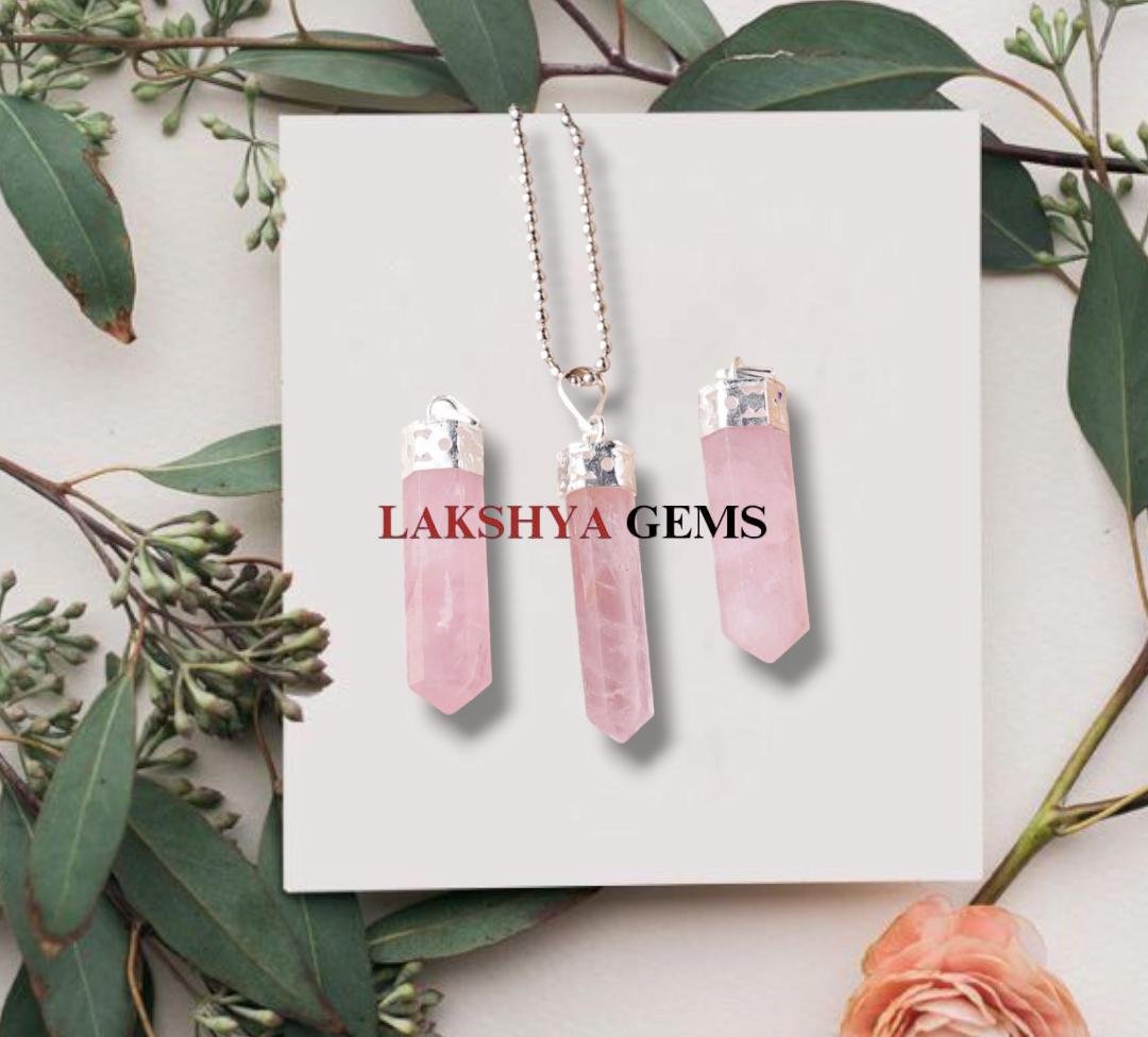 Natural Rose Quartz pencil pendant with soft pink translucent color and silver-toned bail. lakshya gems