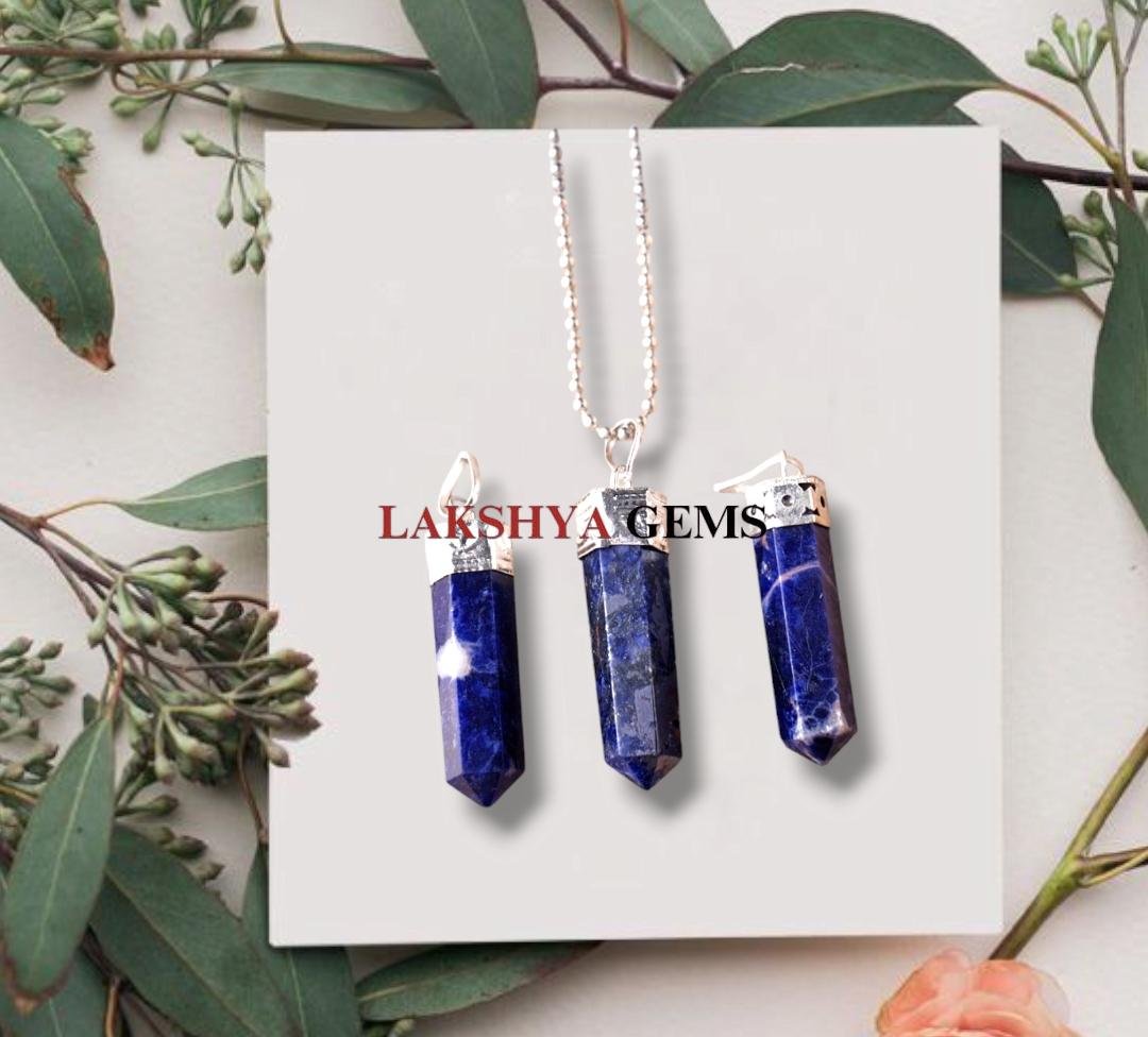 Natural Lapis Lazuli pencil pendant with deep blue color and golden pyrite inclusions.