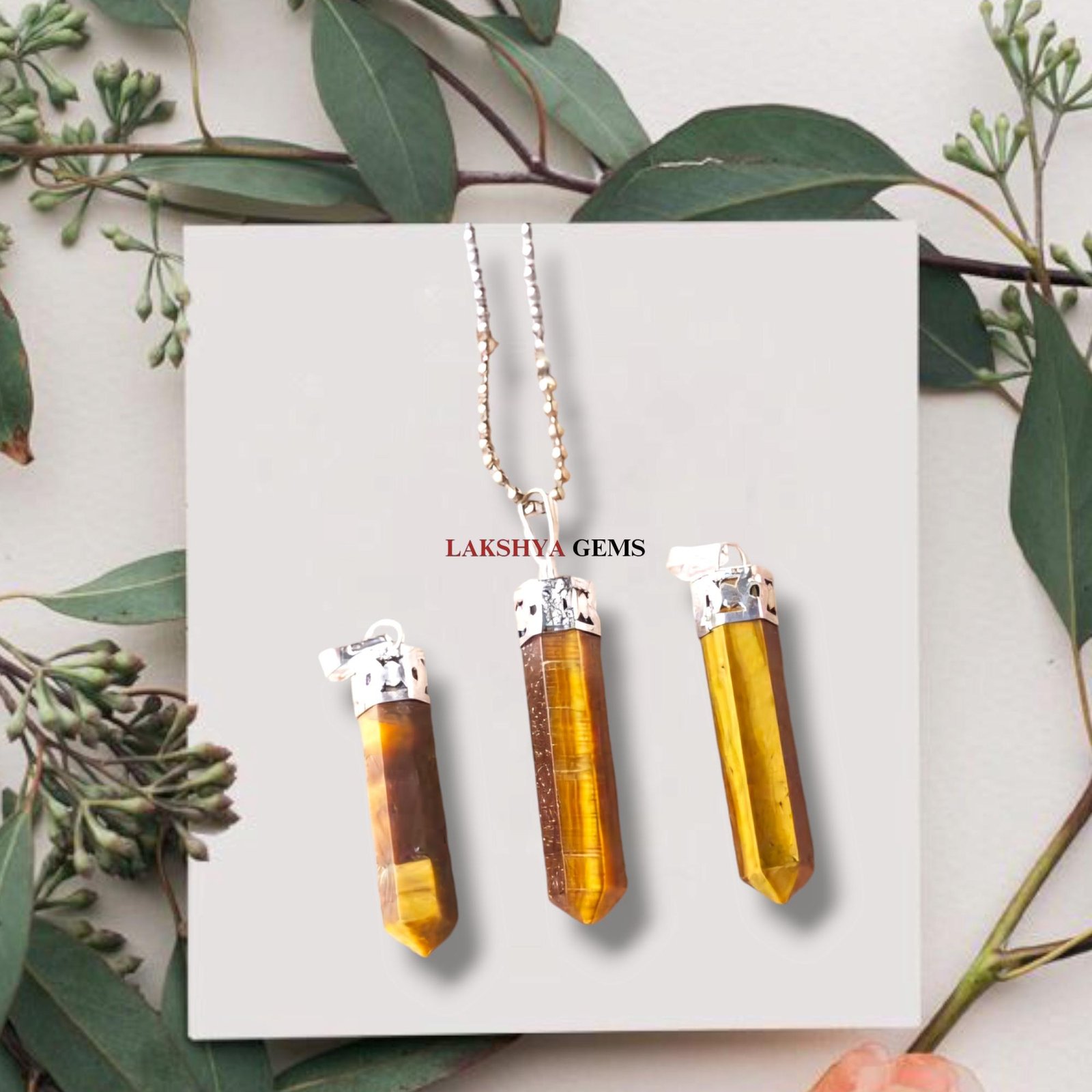 Natural Tiger’s Eye pencil pendant with golden chatoyant bands and silver-etched bail.