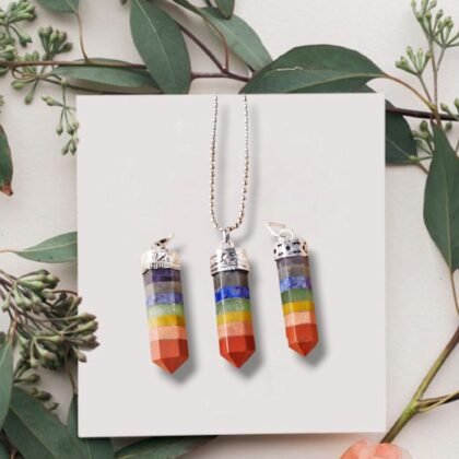 Natural Seven Chakra pencil pendant featuring seven layers of colorful healing gemstones.